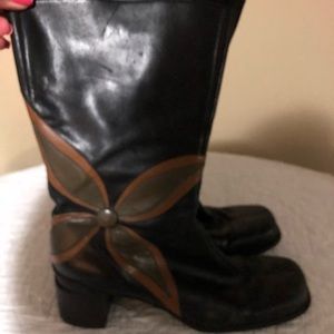 Above the ankle black/brown/blue boots by Clarks.